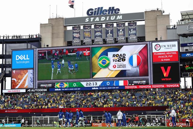 France's players warm up ahead of a friendly football match between Brazil and France at Gillette Stadium in Foxborough, Massachusetts, on March 26, 2026. (Photo by FRANCK FIFE / AFP)