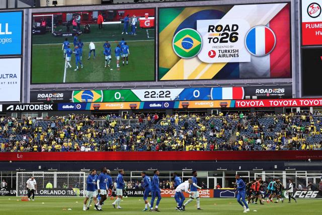 France's players warm up ahead of a friendly football match between Brazil and France at Gillette Stadium in Foxborough, Massachusetts, on March 26, 2026. (Photo by FRANCK FIFE / AFP)