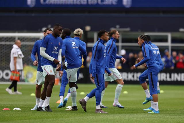 France forward and captain Kylian Mbappe and teammates warm up ahead of a friendly football match between Brazil and France at Gillette Stadium in Foxborough, Massachusetts, on March 26, 2026. (Photo by FRANCK FIFE / AFP)