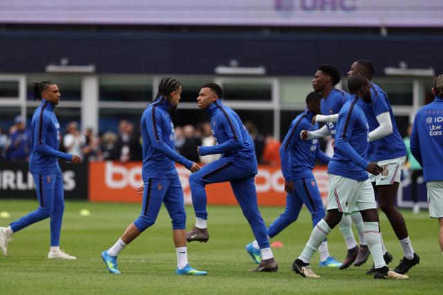 France forward and captain Kylian Mbappe and teammates warm up ahead of a friendly football match between Brazil and France at Gillette Stadium in Foxborough, Massachusetts, on March 26, 2026. (Photo by FRANCK FIFE / AFP)