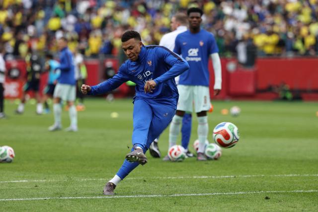 France forward and captain Kylian Mbappe warms up ahead of a friendly football match between Brazil and France at Gillette Stadium in Foxborough, Massachusetts, on March 26, 2026. (Photo by FRANCK FIFE / AFP)