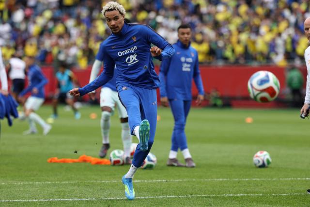 France forward Hugo Ekitike warms up ahead of a friendly football match between Brazil and France at Gillette Stadium in Foxborough, Massachusetts, on March 26, 2026. (Photo by FRANCK FIFE / AFP)