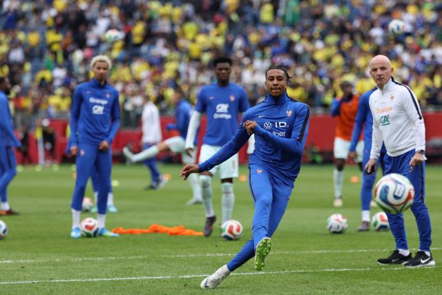 France forward Michael Olise warms up ahead of a friendly football match between Brazil and France at Gillette Stadium in Foxborough, Massachusetts, on March 26, 2026. (Photo by FRANCK FIFE / AFP)
