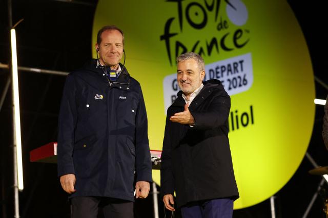 Tour de France General Director Christian Prudhomme (L) and Mayor of Barcelona Jaume Collboni attend the 100-Day Grand Depart Tour de France 2026 celebration, on March 26, 2026, in Barcelona. Barcelona today kicks off the 100-day countdown to the Tour de France 2026 which will start in this town on July 4, 2026. (Photo by Lluis GENE / AFP)