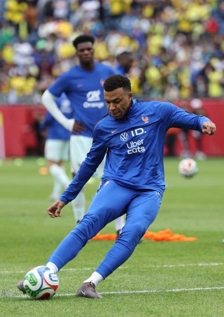 France forward and captain Kylian Mbappe warms up ahead of a friendly football match between Brazil and France at Gillette Stadium in Foxborough, Massachusetts, on March 26, 2026. (Photo by FRANCK FIFE / AFP)