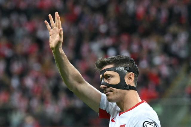 Poland's forward #09 Robert Lewandowski waves prior to the play-off FIFA World Cup 2026 European qualification semi-final football match between Poland and Albania in Warsaw on March 26, 2026. (Photo by Sergei GAPON / AFP)