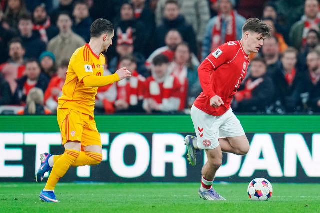 North Macedonia 's midfielder Enis Bardhi and Denmark's defender Joachim Maehle vie for the ball during the FIFA World Cup 2026 European qualification semi-final football match between Denmark and North Macedonia in Copenhagen on March 26, 2026. (Photo by Liselotte Sabroe / Ritzau Scanpix / AFP) / Denmark OUT