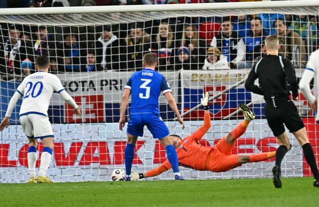 Slovakia's goalkeeper #01 Martin Dubravka makes a save during the play-off 2026 FIFA World Cup European qualification semi-final football match between Slovakia and Kosovo in Bratislava on March 26, 2026. (Photo by Joe Klamar / AFP)