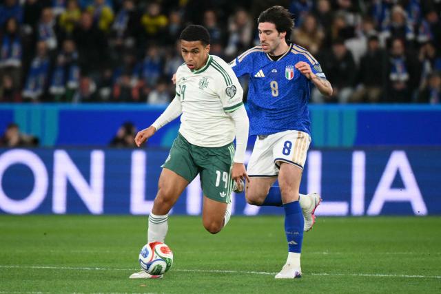 Northern Ireland's defender #19 Shea Charles fights for the ball with Italy's midfielder #08 Sandro Tonali during the play-off FIFA World Cup 2026 European qualification semi-final football match between Italy and North Ireland at the Gewiss stadium in Bergamo, on March 26, 2026. (Photo by Alberto PIZZOLI / AFP)