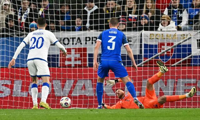 Slovakia's goalkeeper #01 Martin Dubravka saves a ball during the play-off 2026 FIFA World Cup European qualification semi-final football match between Slovakia and Kosovo in Bratislava on March 26, 2026. (Photo by Joe Klamar / AFP)