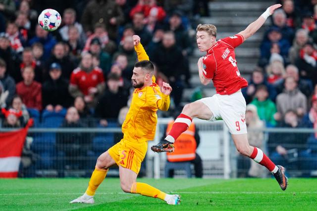 Denmark's forward #09 Rasmus Hojlund and North Macedonia 's defender Gjoko Zajkov vie for the ball during the FIFA World Cup 2026 European qualification semi-final football match between Denmark and North Macedonia in Copenhagen on March 26, 2026. (Photo by Liselotte Sabroe / Ritzau Scanpix / AFP) / Denmark OUT