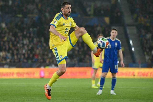 Ukraine's midfielder #21 Ivan Kaliuzhnyi kicks the ball during the 2026 World Cup qualifiers Europe zone semifinal football match between Ukraine and Sweden at Ciutat de Valencia Stadium in Valencia on March 26, 2026. (Photo by JOSE JORDAN / AFP)