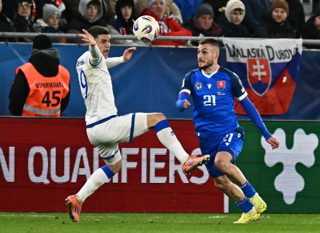 Kosovo's forward #09 Albion Rrahmani (L) and Slovakia's midfielder #21 Matus Bero vie for the ball during the play-off 2026 FIFA World Cup European qualification semi-final football match between Slovakia and Kosovo in Bratislava on March 26, 2026. (Photo by Joe Klamar / AFP)