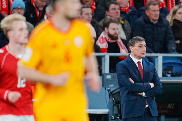 North Macedonia's head coach Goce Sedloski (R) looks on during the FIFA World Cup 2026 European qualification semi-final football match between Denmark and North Macedonia in Copenhagen on March 26, 2026. (Photo by Liselotte Sabroe / Ritzau Scanpix / AFP) / Denmark OUT