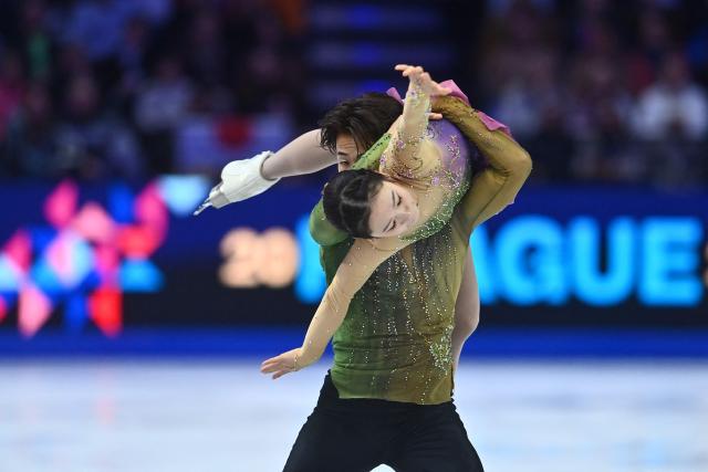 TOPSHOT - Japan’s Yuna Nagaoka and Sumitada Moriguchi perform during the pairs free skating program of the 2026 ISU Figure Skating World Championships in Prague on March 26, 2026. (Photo by Michal Cizek / AFP)