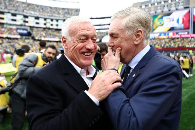 France's head coach Didier Deschamps (L) and Brazil's coach Carlo Ancelotti chat ahead of a friendly football match between Brazil and France at Gillette Stadium in Foxborough, Massachusetts, on March 26, 2026. (Photo by FRANCK FIFE / AFP)