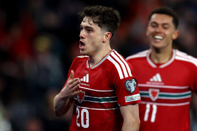 Wales' midfielder #20 Daniel James celebrates scoring the team's first goal during the FIFA World Cup qualification semi-final football match between Wales and Bosnia and Herzegovina, at Cardiff City Stadium, in Cardiff, on March 26, 2026. (Photo by Darren Staples / AFP)