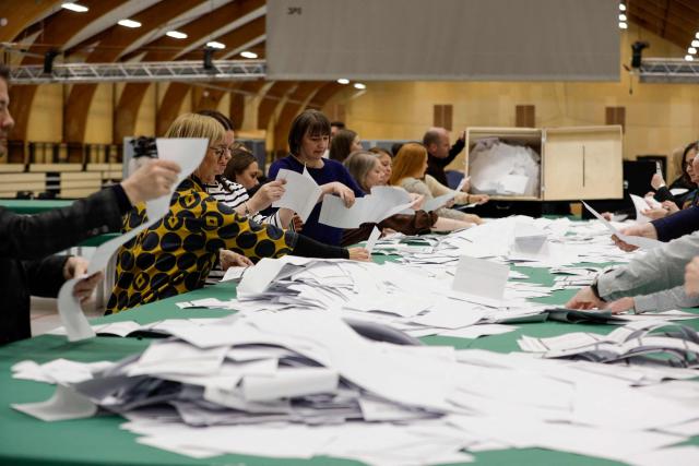 Poll workers count votes after the general election to the Faroese Parliament in Torshavn, Faroe Islands, on March 26, 2026. Voters in the Faroe Islands, an autonomous Danish territory like Greenland, elect their parliament on March 26 after a campaign that largely ignored global tensions in favour of local issues. The government is the self-governing administration of the archipelago, led by the Prime Minister. The government is usually elected every four years by the Faroese Parliament. (Photo by Álvur Haraldsen / Ritzau Scanpix / AFP) / Denmark OUT