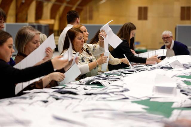 Poll workers count votes after the general election to the Faroese Parliament in Torshavn, Faroe Islands, on March 26, 2026. Voters in the Faroe Islands, an autonomous Danish territory like Greenland, elect their parliament on March 26 after a campaign that largely ignored global tensions in favour of local issues. The government is the self-governing administration of the archipelago, led by the Prime Minister. The government is usually elected every four years by the Faroese Parliament. (Photo by Álvur Haraldsen / Ritzau Scanpix / AFP) / Denmark OUT