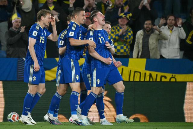 Sweden's forward #17 Viktor Gyokeres (R) celebrates scoring his team's second goal during the 2026 World Cup qualifiers Europe zone semifinal football match between Ukraine and Sweden at Ciutat de Valencia Stadium in Valencia on March 26, 2026. (Photo by JOSE JORDAN / AFP)
