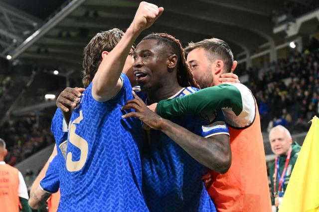 Italy's forward #11 Moise Kean celebrates after scoring his team's second goal during the play-off FIFA World Cup 2026 European qualification semi-final football match between Italy and North Ireland at the Gewiss stadium in Bergamo, on March 26, 2026. (Photo by Alberto PIZZOLI / AFP)