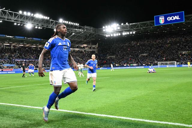 Italy's forward #11 Moise Kean celebrates after scoring his team's second goal during the play-off FIFA World Cup 2026 European qualification semi-final football match between Italy and North Ireland at the Gewiss stadium in Bergamo, on March 26, 2026. (Photo by Alberto PIZZOLI / AFP)