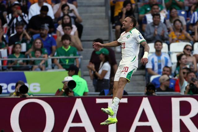 Suriname's defender #20 Liam van Gelderen celebrates after scoring his team's first goal during the 2026 FIFA World Cup qualifiers semi-final playoff football match between Bolivia and Suriname at the BBVA Stadium in Guadalupe, Mexico on March 26, 2026. (Photo by Julio Cesar AGUILAR / AFP)