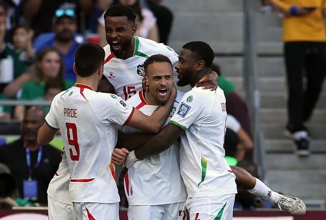 Suriname's defender #20 Liam van Gelderen (C) celebrates with teammates forward #09 Joel Piroe (L), defender #15 Djavan Anderson (C, back) and defender #04 Stefano Denswil after scoring his team's first goal during the 2026 FIFA World Cup qualifiers semi-final playoff football match between Bolivia and Suriname at the BBVA Stadium in Guadalupe, Mexico on March 26, 2026. (Photo by Julio Cesar AGUILAR / AFP)