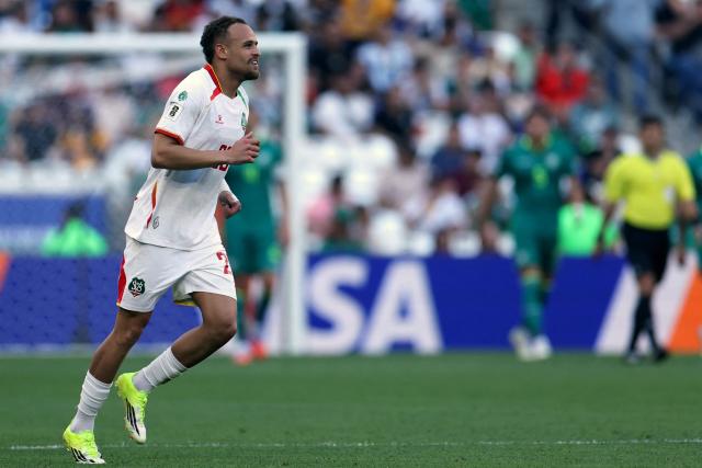 Suriname's defender #20 Liam van Gelderen celebrates after scoring his team's first goal during the 2026 FIFA World Cup qualifiers semi-final playoff football match between Bolivia and Suriname at the BBVA Stadium in Guadalupe, Mexico on March 26, 2026. (Photo by Julio Cesar AGUILAR / AFP)