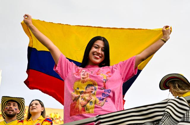 A Colombia fan cheers ahead of a friendly football match between Colombia and Croatia at Camping World Stadium in Orlando, Florida, on March 26, 2026. (Photo by Miguel J. Rodriguez CARRILLO / AFP)