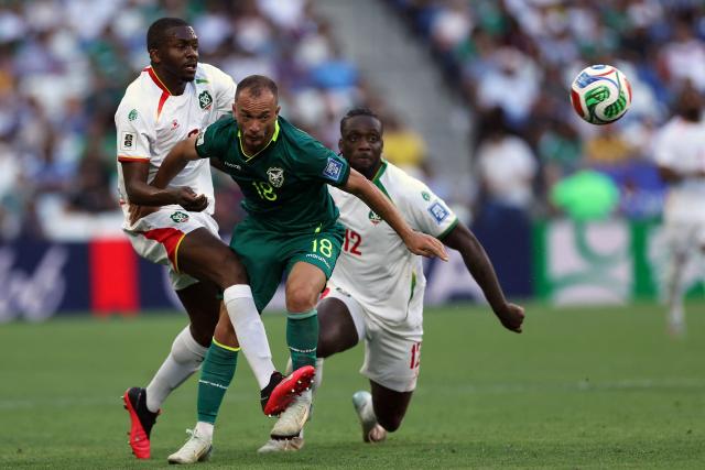 Bolivia's midfielder #18 Juan Godoy (C) fights for the ball with Suriname's defender #02 Anfernee Dijksteel and defender #12 Leo Abena during the 2026 FIFA World Cup qualifiers semi-final playoff football match between Bolivia and Suriname at the BBVA Stadium in Guadalupe, Mexico on March 26, 2026. (Photo by Julio Cesar AGUILAR / AFP)