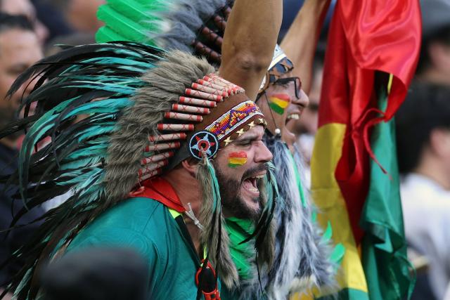 Fans of Bolivia celebrate their team's victory during the 2026 FIFA World Cup qualifiers semi-final playoff football match between Bolivia and Suriname at the BBVA Stadium in Guadalupe, Mexico on March 26, 2026. (Photo by Julio Cesar AGUILAR / AFP)