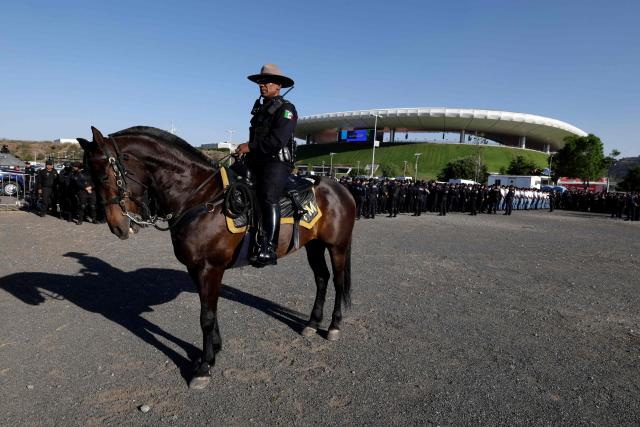 Members of the mounted police patrol the surroundings of the Akron Stadium before the start of the 2026 FIFA World Cup qualifiers semi-final playoff football match between New Caledonia and Jamaica in Zapopan, state of Jalisco, Mexico on March 26, 2026. (Photo by Ulises Ruiz / AFP)