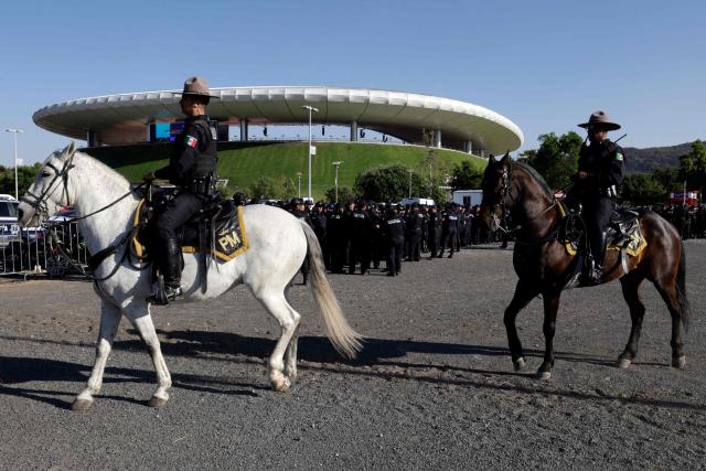 Members of the mounted police patrol the surroundings of the Akron Stadium before the start of the 2026 FIFA World Cup qualifiers semi-final playoff football match between New Caledonia and Jamaica in Zapopan, state of Jalisco, Mexico on March 26, 2026. (Photo by Ulises Ruiz / AFP)