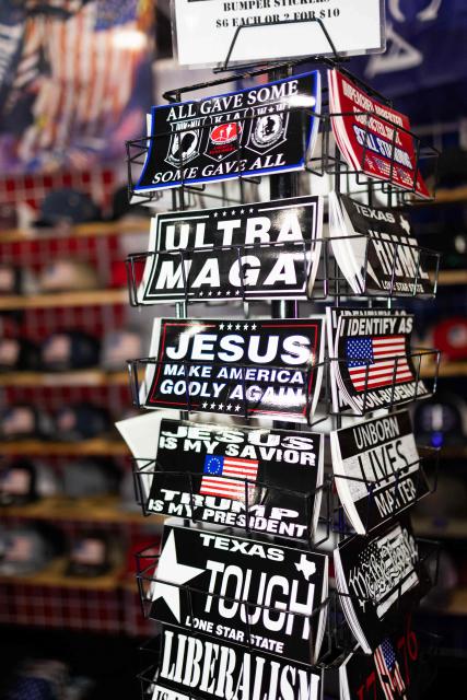 Conservative-themed stickers are displayed for sale at the Conservative Political Action Conference (CPAC) in Grapevine, Texas, on March 26, 2026. American conservatives converge on Texas this week for what organizers bill as their largest and most influential gathering, with the Iran war and fears of a punishing midterm election cycle heightening the stakes. (Photo by Leandro Lozada / AFP)