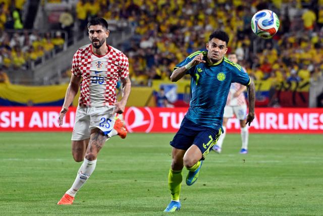 Colombia's forward #07 Luis Diaz and Croatia's defender #25 Martin Erlic vie for the ball during a friendly football match between Colombia and Croatia at Camping World Stadium in Orlando, Florida, on March 26, 2026. (Photo by Miguel J. Rodriguez CARRILLO / AFP)