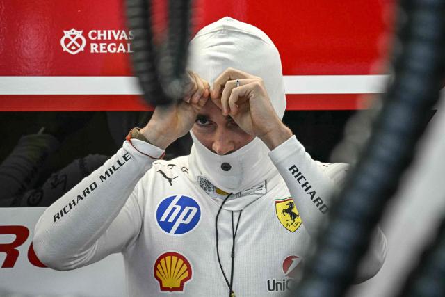 Ferrari's Monegasque driver Charles Leclerc prepares before the first practice session of the Formula One Japanese Grand Prix in Suzuka, Mie prefecture on March 27, 2026. (Photo by Philip FONG / AFP)