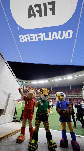 Mascots of the World Cup Maple the Moose (L), Zayu the Jaguar (C) and Clutch the Bald Eagle attend the 2026 FIFA World Cup qualifiers semi-final playoff football match between New Caledonia and Jamaica at the Akron Stadium in Zapopan, state of Jalisco, Mexico on March 26, 2026. (Photo by Ulises Ruiz / AFP)