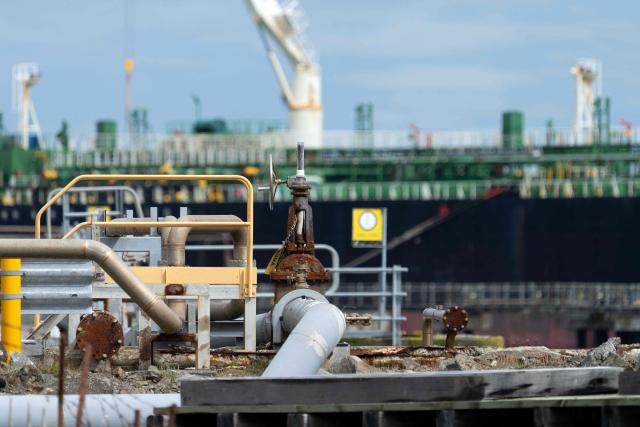 The tanker ship Oak Express unloads oil at the Seaview fuel terminal at Point Howard in Wellington on March 27, 2026. (Photo by Marty MELVILLE / AFP)
