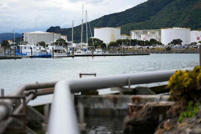 This picture shows fuel pipe lines taking oil from the tanker ship Oak Express at the Seaview fuel terminal at Point Howard in Wellington on March 27, 2026. (Photo by Marty MELVILLE / AFP)