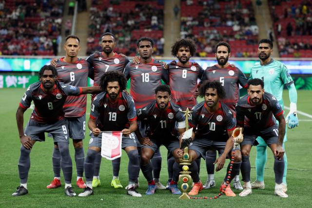 Players of New Caledonia pose for a picture ahead of the 2026 FIFA World Cup qualifiers semi-final playoff football match between New Caledonia and Jamaica at the Akron Stadium in Zapopan, Mexico on March 26, 2026. (Photo by Ulises Ruiz / AFP)