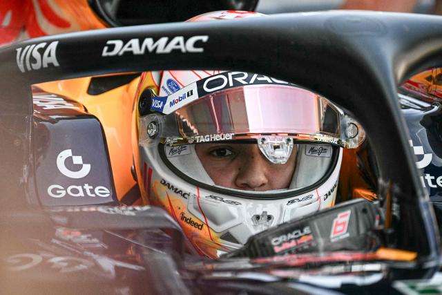 Red Bull Racing's French driver Isack Hadjar arrives to the pit lane during the first practice session ahead of the Formula One Japanese Grand Prix at the Suzuka circuit in Suzuka, Mie prefecture on March 27, 2026. (Photo by Philip FONG / AFP)