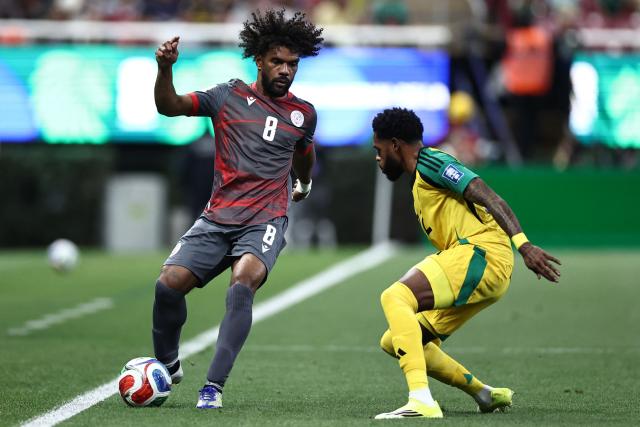 New Caledonia's midfielder #08 Joris Kenon and Jamaica's defender #22 Ronaldo Webster fight for the ball during the 2026 FIFA World Cup qualifiers semi-final playoff football match between New Caledonia and Jamaica at the Akron Stadium in Zapopan, Mexico on March 26, 2026. (Photo by Ulises Ruiz / AFP)