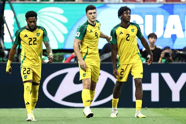 Jamaica's forward #09 Bailey Cadamarteri (C) celebrates with teammates defender #22 Ronaldo Webster and forward #02 Andre Brooks  after scoring the opening goal during the 2026 FIFA World Cup qualifiers semi-final playoff football match between New Caledonia and Jamaica at the Akron Stadium in Zapopan, Mexico on March 26, 2026. (Photo by Ulises Ruiz / AFP)