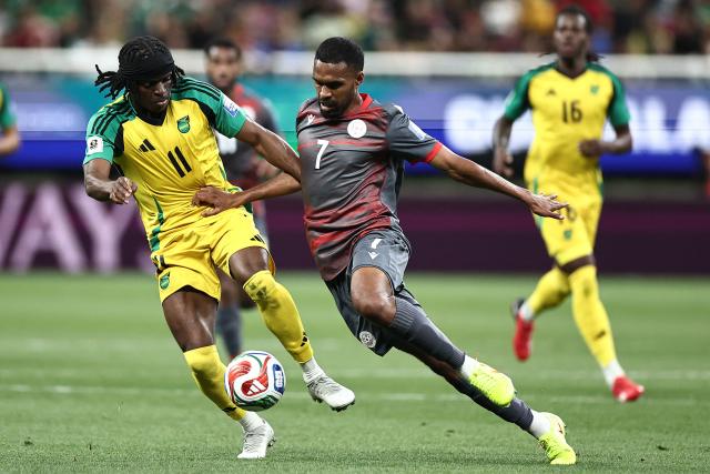 Jamaica's forward #11 Tyreece Campbell and New Caledonia's midfielder #07 Jekob Jeno fight for the ball during the 2026 FIFA World Cup qualifiers semi-final playoff football match between New Caledonia and Jamaica at the Akron Stadium in Zapopan, Mexico on March 26, 2026. (Photo by Ulises Ruiz / AFP)