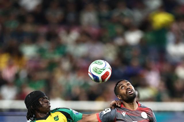 Jamaica's forward #11 Tyreece Campbell and New Caledonia's midfielder #07 Jekob Jeno fight for the ball during the 2026 FIFA World Cup qualifiers semi-final playoff football match between New Caledonia and Jamaica at the Akron Stadium in Zapopan, Mexico on March 26, 2026. (Photo by Ulises Ruiz / AFP)