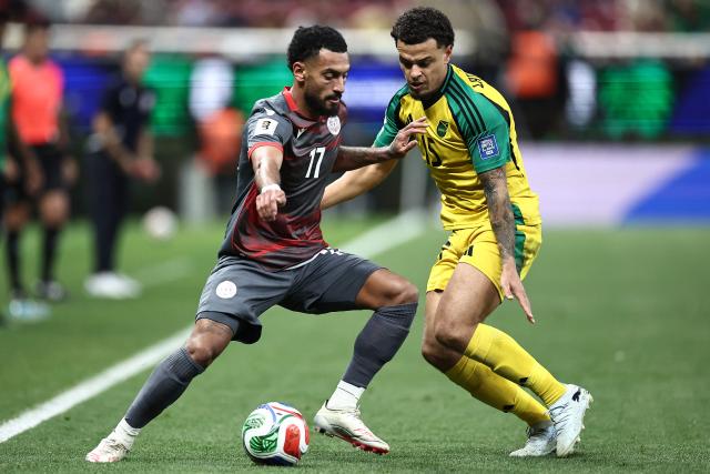 New Caledonia's midfielder #11 Cesar Zeoula and Jamaica's defender #15 Joel Latibeaudiere fight for the ball during the 2026 FIFA World Cup qualifiers semi-final playoff football match between New Caledonia and Jamaica at the Akron Stadium in Zapopan, Mexico on March 26, 2026. (Photo by Ulises Ruiz / AFP)