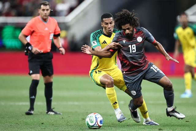 Jamaica's midfielder #14 Isaac Hayden and New Caledonia's defender #19 Joseph Athale fight for the ball during the 2026 FIFA World Cup qualifiers semi-final playoff football match between New Caledonia and Jamaica at the Akron Stadium in Zapopan, Mexico on March 26, 2026. (Photo by Ulises Ruiz / AFP)