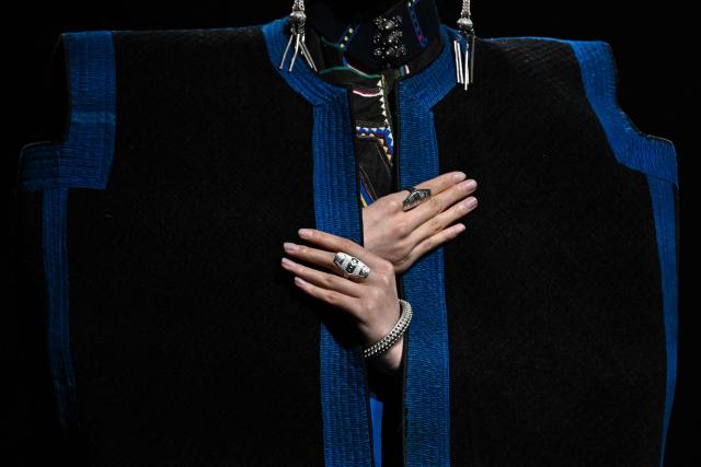 A model presents a creation by Yan Liang during the China Fashion Week in Beijing on March 26, 2026. (Photo by Pedro PARDO / AFP)