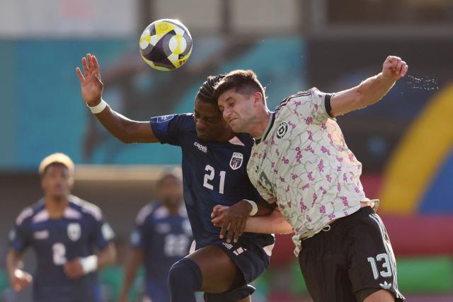 Nuno da Costa of Cape Verde (L) and Benjamín Kuscevic of Chile compete for the ball during the international friendly football match between Chile and Cape Verde at Eden Park in Auckland on March 27, 2026. (Photo by Michael Bradley / AFP)
